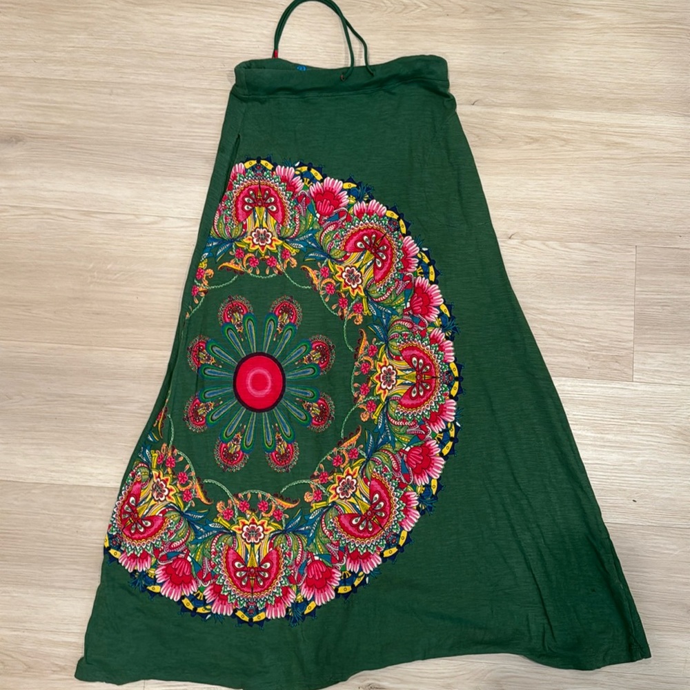 Small Desigual skirt, green with floral design in pink, red, yellow and green.